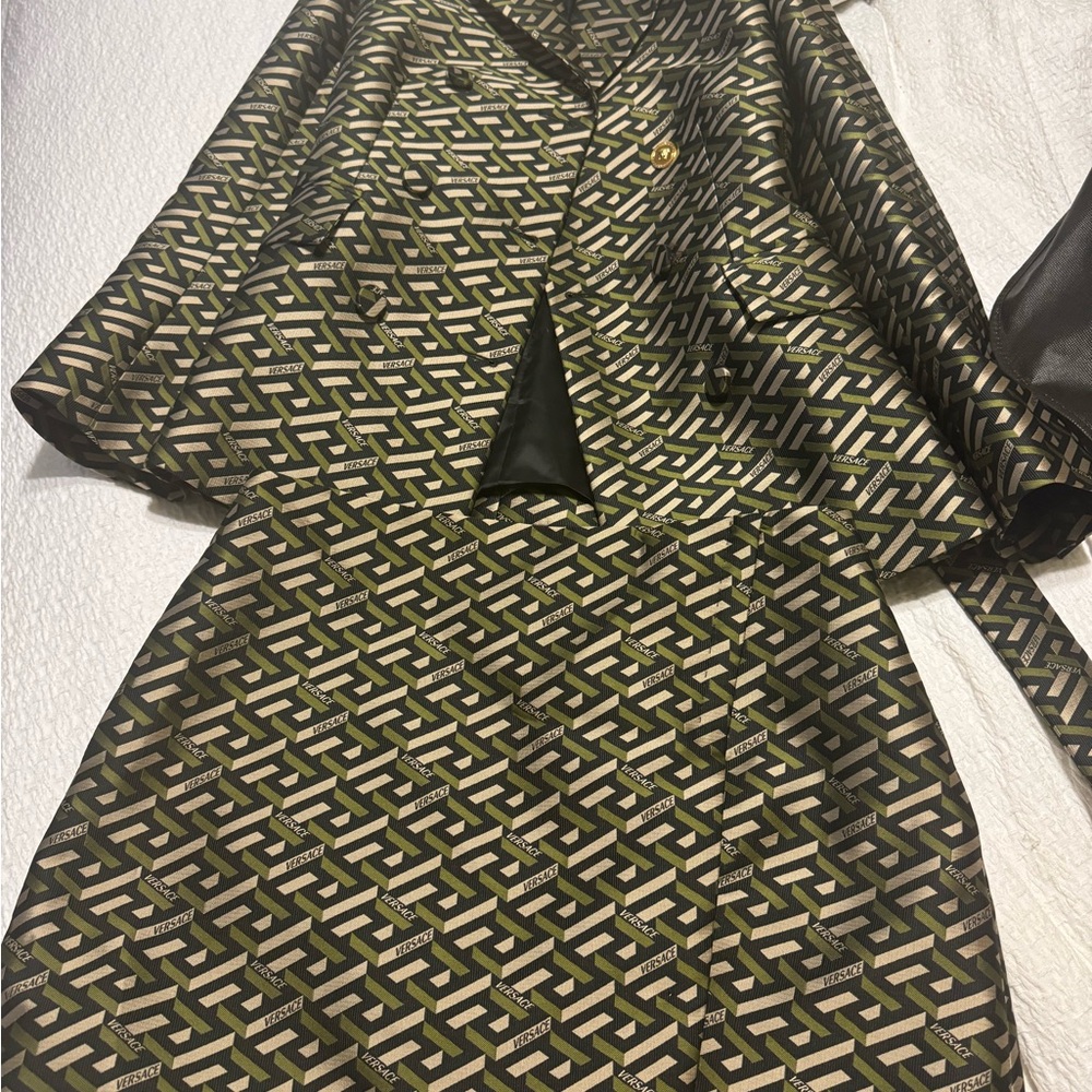 Authentic Versace jacket and skirt. Only wore once in excellent condition.
